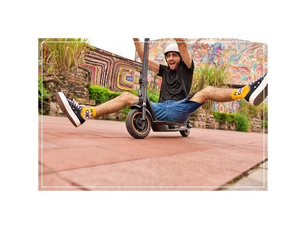 a man having fun with yadea ks5 pro electric scooter